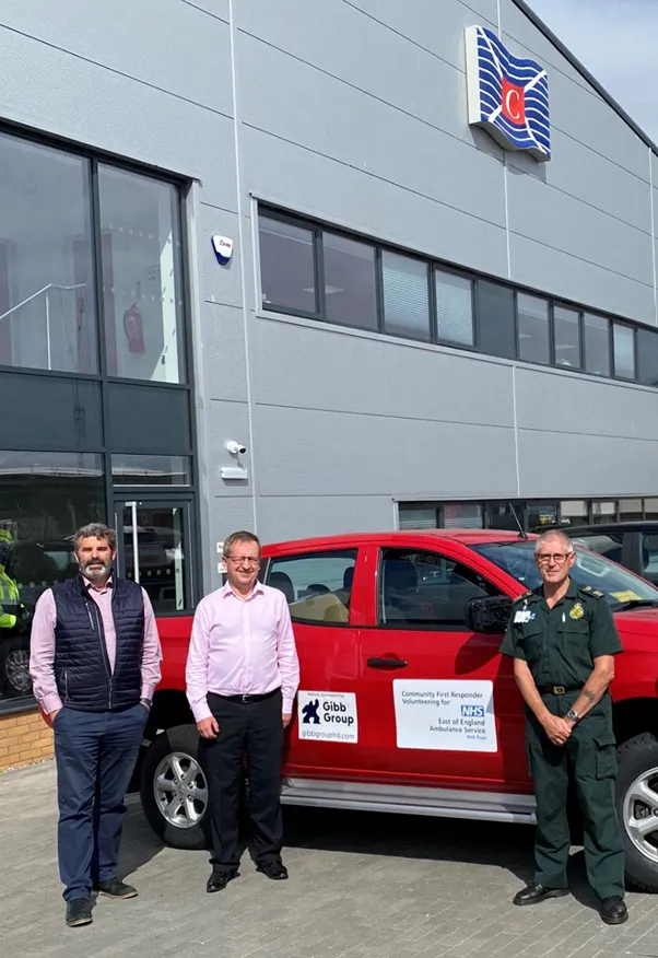 Gibb Loan Vehicle To Ambulance Service 3 men with red car