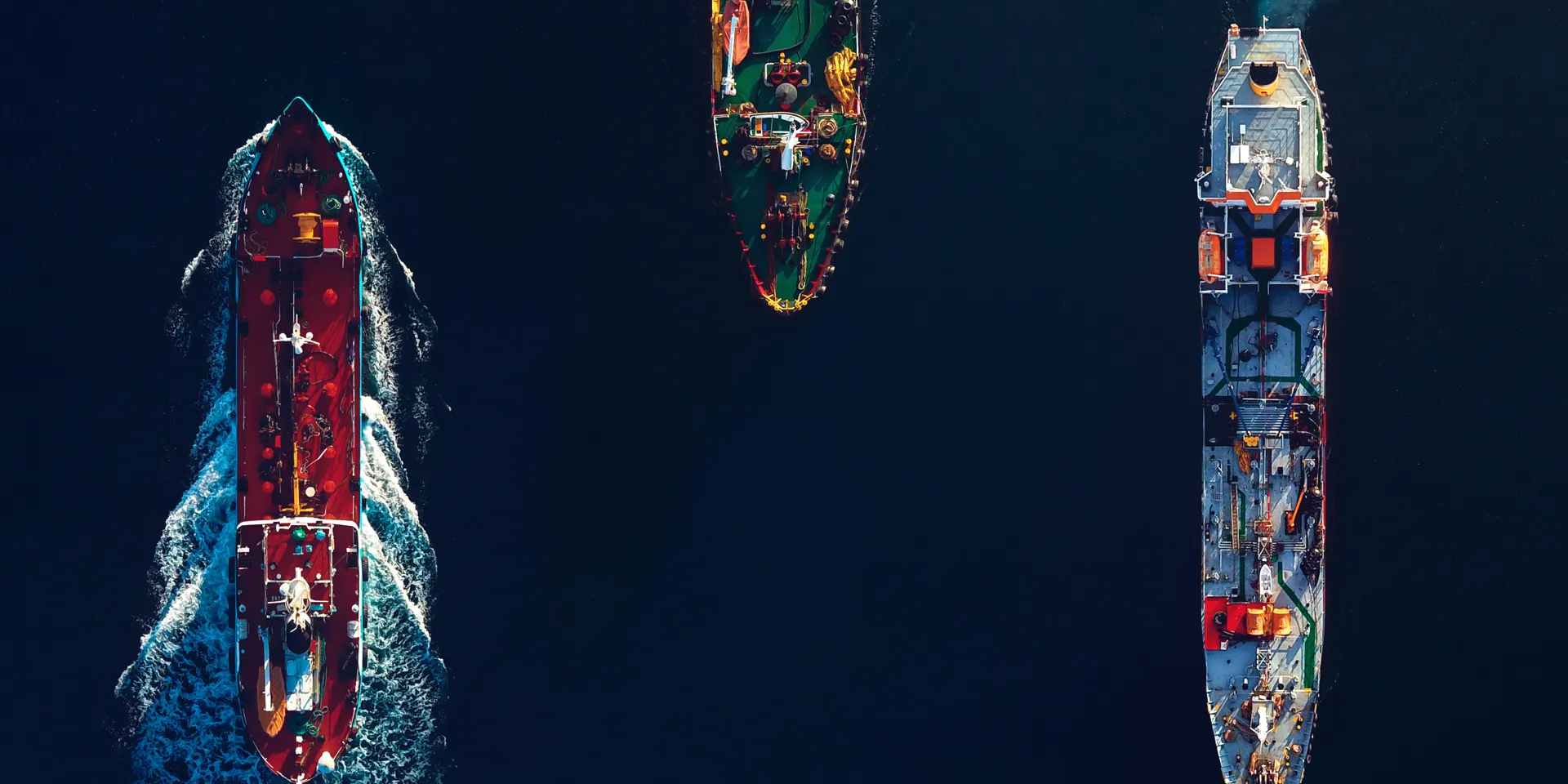 Three ships navigating dark waters.
