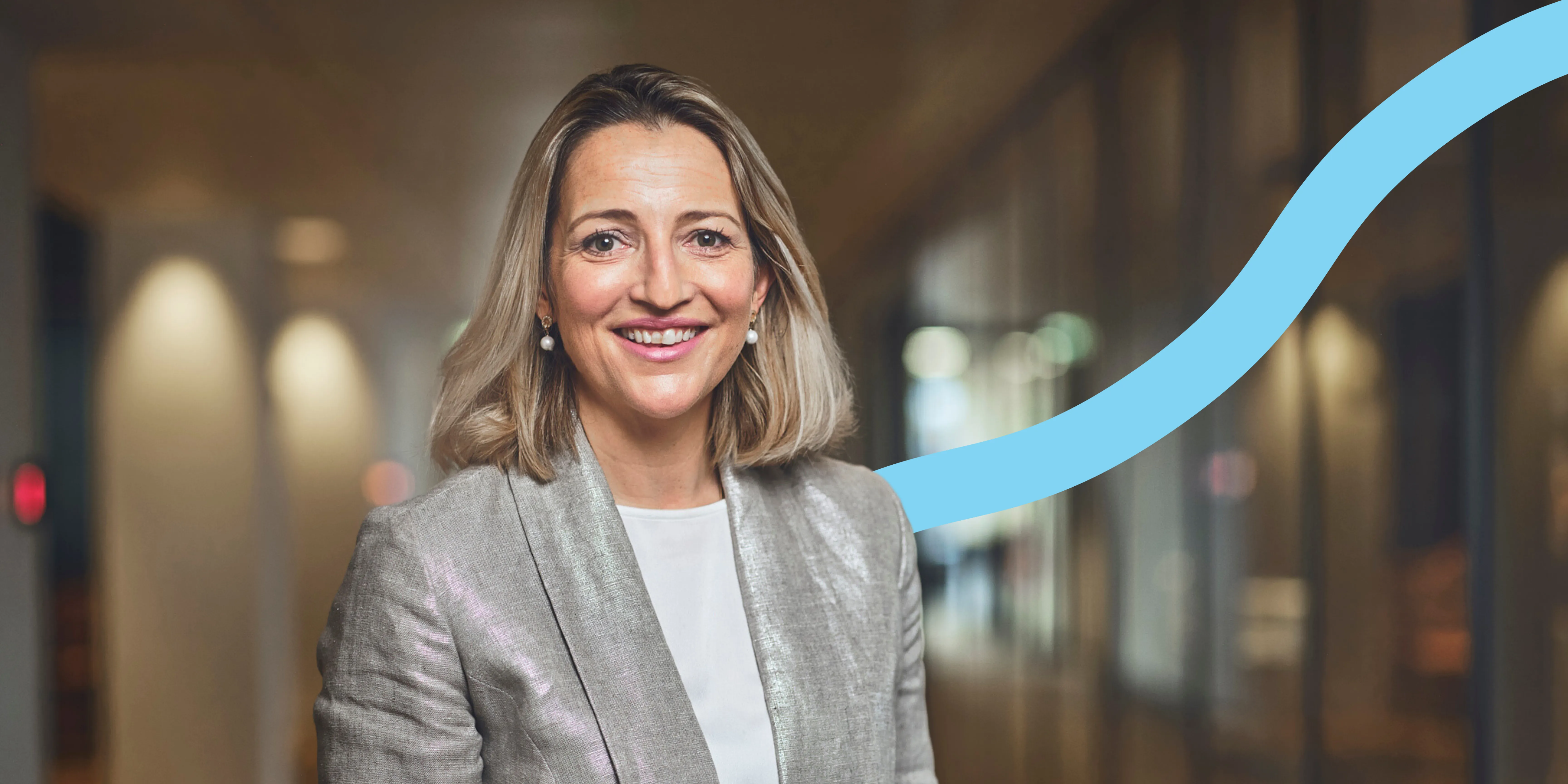 woman smiling, blue graphic background