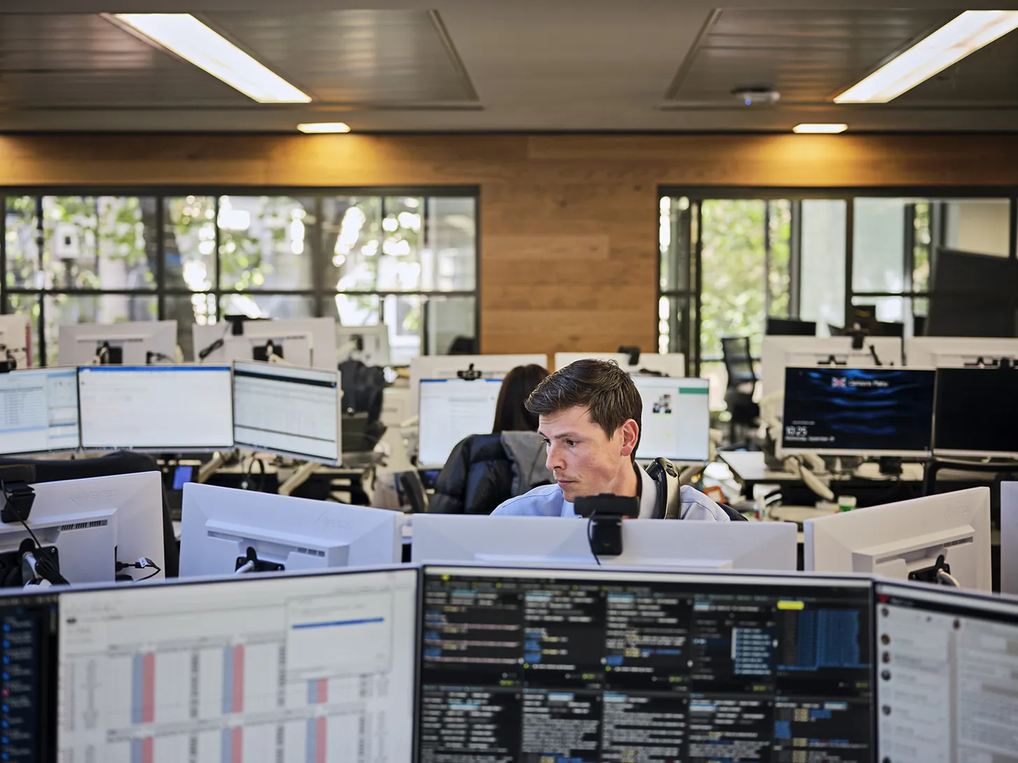 broker looking at his computer screens