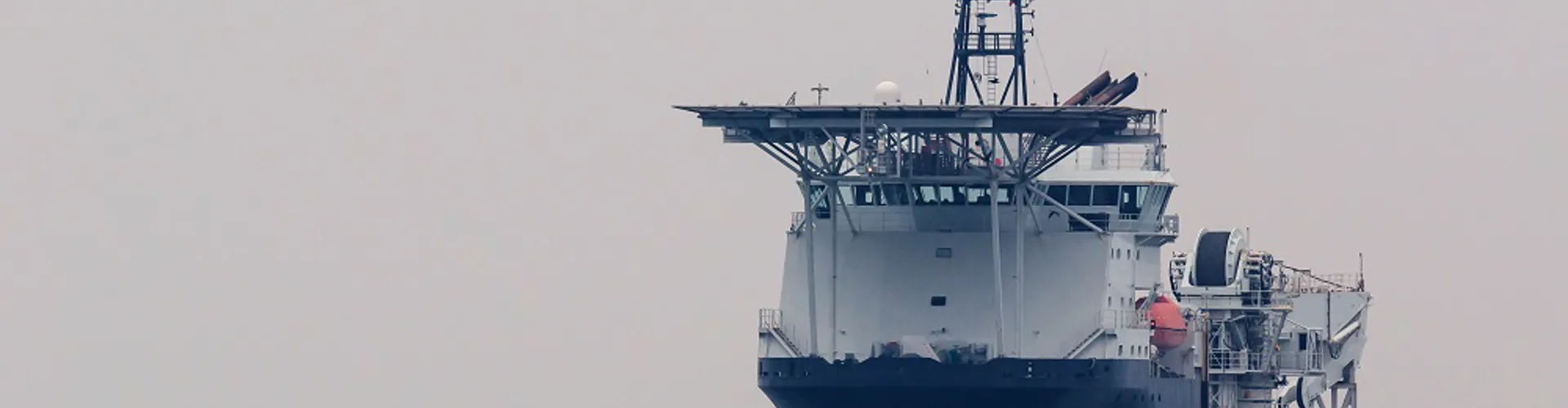 Large ship navigating on calm waters.